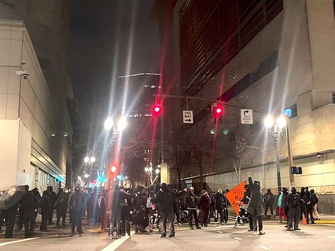 People protest after the ‘not guilty’ verdict was announced in the trial of Kyle Rittenhouse, in Portland, Oregon, US, on November 19, 2021 in this still image obtained from a video. 