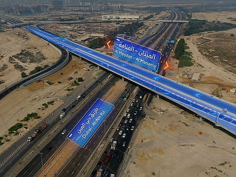The new bridge linking Al Manama and Al Meydan Streets’ crossing over Dubai-Al Ain Road consists of four lanes in each direction.