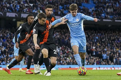 Manchester City's Ilkay Gundogan duels for the ball with Everton's Seamus Coleman during the English Premier League match at Etihad stadium in Manchester, England. City won 3-0.