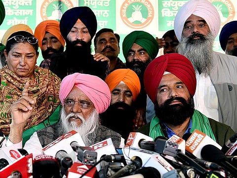 Farmer leaders Balbir Singh Rajewal (L) with Tejinder Singh Virk (R) speak to the media after Samyukt Kisan Morcha (SKM) meeting, at Singhu border, in New Delhi on Sunday, November 21, 2021. 