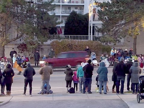 An image shows a car along a parade route in Waukesha, that later plowed into a crowd. 