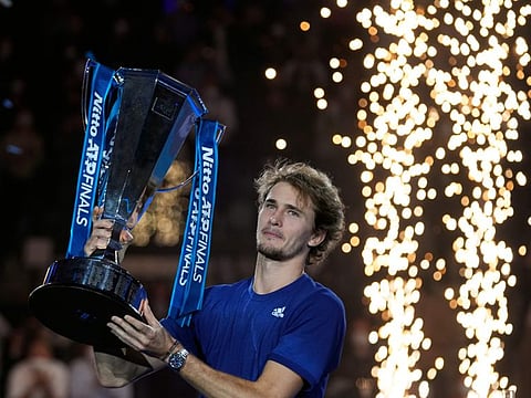 Alexander Zverev of Germany holds his trophy after winning the singles final tennis match of the ATP World Tour Finals, at the Pala Alpitour in Turin, Italy. Zverev defeated Daniil Medvedev of Russia 6-4/6-4.