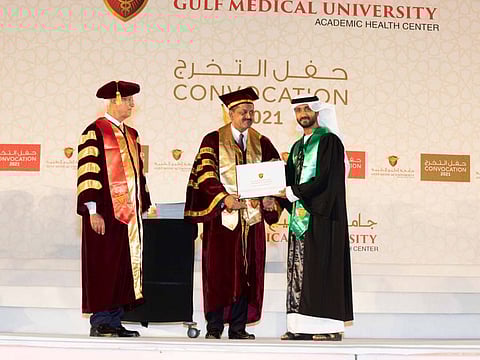 (Lto R) Chancellor Prof. Hossam Hamdy; Dr. Thumbay Moideen  Founder, President Board of Trustees of GMU  conferring the degree to a  student at the GMU Convocation
