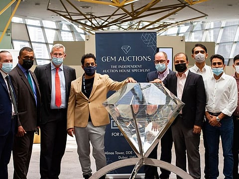 DMCC and Gem Auctions officials pose for a photo opportunity after a successful first auction showing. 