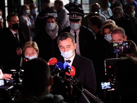 French Interior Minister Gerald Darmanin answers the press in Calais, northern France, Wednesday, Nov. 24, 2021.