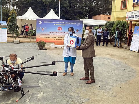 A special container with COVID-19 vaccines and syringes being air delivered through an Octacopter drone by National Aerospace Laboratories (NAL), on the city outskirts of Bengaluru.