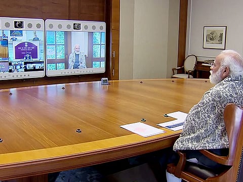 Prime Minister Narendra Modi chairing a meeting on the situation relating to COVID-19 and vaccination with top officials, through video conferencing, in New Delhi on Saturday.  