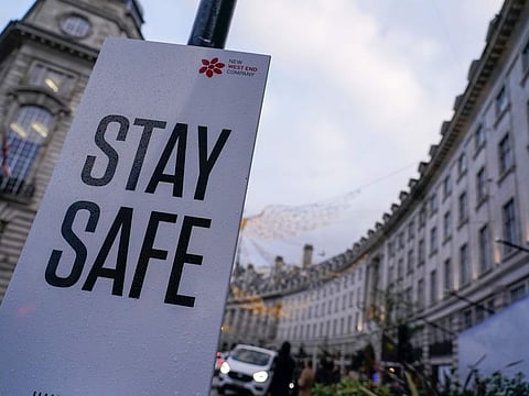 A sign in Regent Street, in London, on November 26, 2021. A slew of nations moved to stop air travel from southern Africa on Friday, and stocks plunged in Asia and Europe in reaction to news of a new, potentially more transmissible COVID-19 variant. 