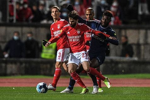 Benfica's forward Rafa da Silva is challenged by Belenenses' Burkinese defender Trova Boni during the Portuguese league football match at the Jamor stadium in Oeiras, outskirts of Lisbon.