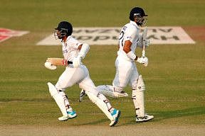 India's Wriddhiman Saha and Axar Patel run between the wicket during Day-4 of the 1st Test match between India and New Zealand, at Green Park International Stadium, in Kanpur.