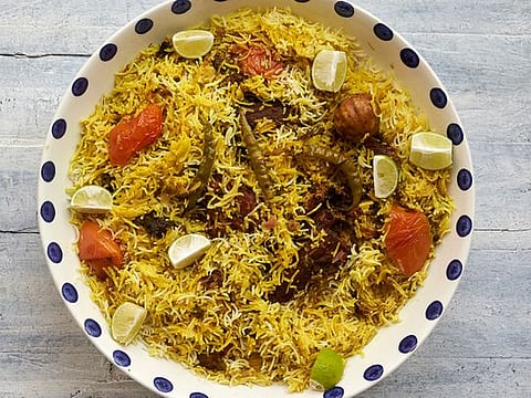 Traditional Emirati recipe for Malleh Fogah or slow-cooked rice with salted fish 