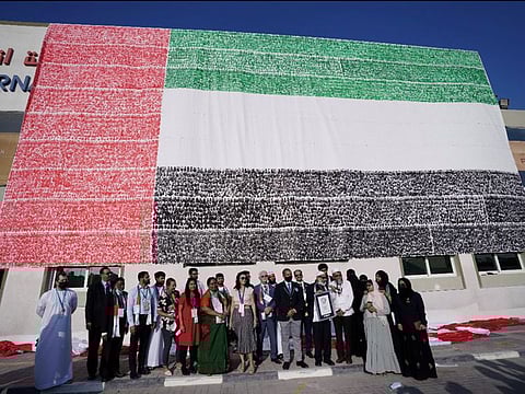 The massive UAE flag mural created by the members of PACE Education Group. 