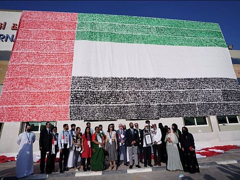 The massive UAE flag mural created by the members of PACE Education Group. 