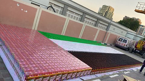 The 73.14 m² four-coloured flag was created with 4,500 Ariel, Tide and Bonux products on Tuesday at the LuLu Hypermarket’s parking lot in Al Barsha.