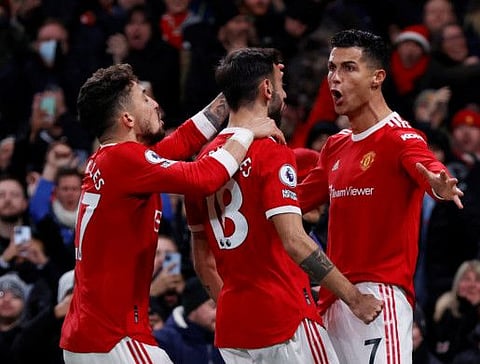 Manchester United's Cristiano Ronaldo celebrates scoring his 800th career goal with teammates during the English Premier League match against Arsenal at Old Trafford.