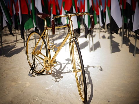 The John Thomson-designed gold-plated bicycle.