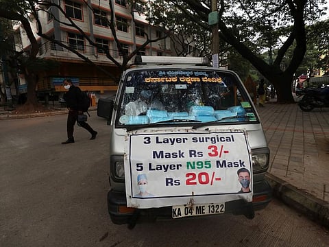 A vendor sells face masks to be used as a precaution against COVID-19 in  Bengaluru.