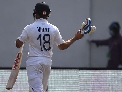 A despondent Virat Kohli walks back after being ruled out by the third umpire on Friday.