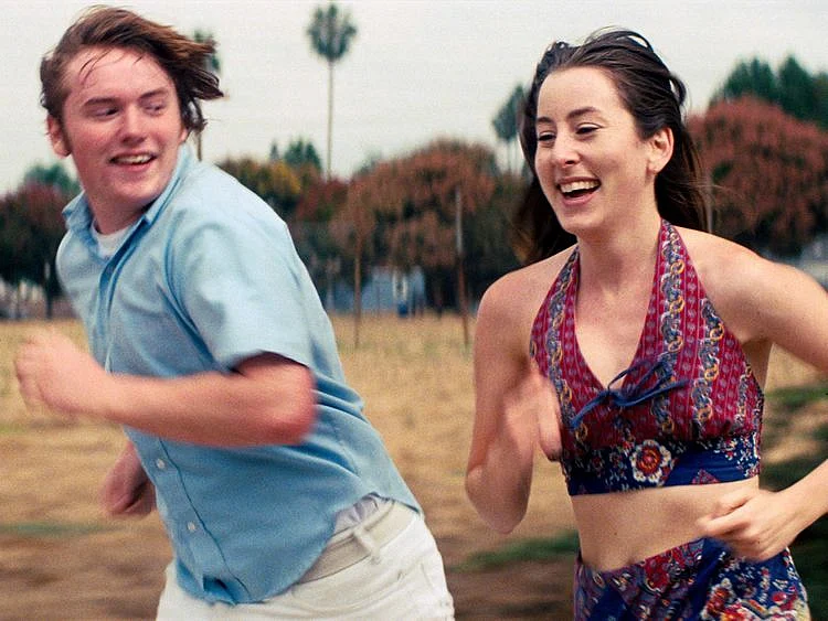 This image released by MGM shows Cooper Hoffman, left, and Alana Haim in a scene from "Licorice Pizza." The National Board of Review named the "Licorice Pizza" as best film of the year. (MGM via AP)