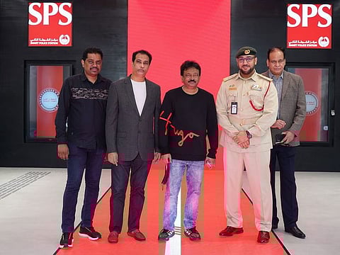 Ram Gopal Varma (centre) during his visit to Dubai Smart Police Station recently 