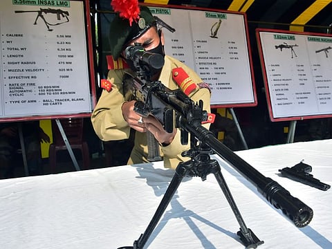 A National Cadet Corps (NCC) Cadet looks through the INSAS rifles at the Indian Arms display during 73rd National Cadet Corps Raising Day celebrations, at Fort William, in Kolkata. The 7.62 X 39 mm caliber AK-203 Rifles will replace in-service INSAS Rifle inducted over three decades ago. AK-203 Assault Rifles, with an effective range of 300 meters, are light weight, robust and easy to use Modern Assault Rifles with proven technology that will enhance the combat potential of soldiers to adequately meet present and envisaged operational challenges.