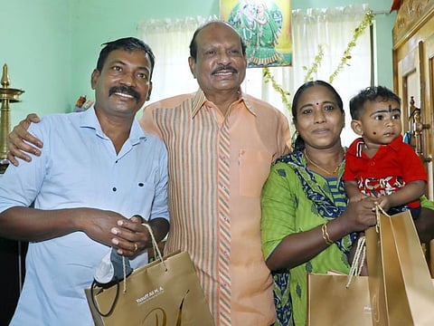 M.A Yusuff Ali with Rajesh, Biji and their son at their house in Panangad, Kerala.