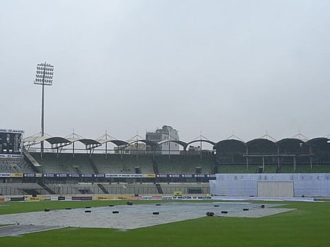 The pitch is covered with plastic sheets as rain interrupts the third day play of the second Test cricket match between Bangladesh and Pakistan at the Sher-e-Bangla National Cricket Stadium in Dhaka.