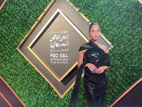 Shanina Shaik looked resplendent in in a black dress at the red carpet event