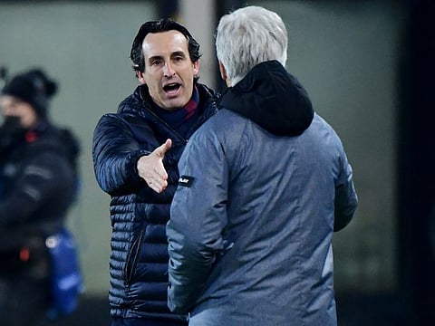Villarreal's coach Unai Emery (left) shakes hands with Atalanta coach Gian Piero Gasperini after their match on Thursday.