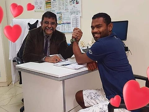 Dr Venkata Kiran with a patient in Abu Dhabi.