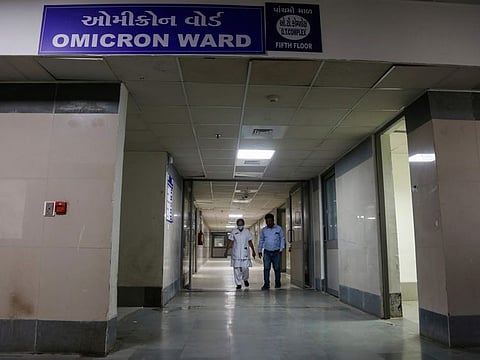 Hospital staff walk past Omicron ward at Civil hospital in Ahmedabad, India. States including Delhi, Rajasthan, Maharashtra, Karnataka and Gujarat have reported cases of the new COVID-19 variant with the total number of Omicron cases in the country going up to 33.
