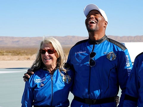 Crewmembers of Blue Origin's New Shepard rocket, Laura Shepard Churchley, daughter of the first American in space Alan Shepard, stands with  NFL hall-of-famer Michael Strahan react after their flight from Launch Site One in West Texas, U.S. December 11, 2021.