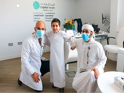 Dr. Mishal Al Kasimi, CEO of Capital Health Group – Specialized Rehabilitation Hospital and Health Shield with the patient Ahmed Al Ghafli 