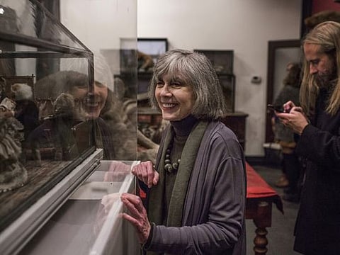 Anne Rice looks at taxidermic creatures on display at the Morbid Anatomy Museum in New York, Nov. 28, 2016. Rice, the Gothic novelist best known for her best-selling book “Interview With the Vampire,” died on Saturday, Dec. 11, 2021. She was 80. 