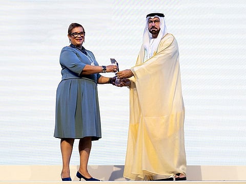 Mohammad Abdullah Al Gergawi, Minister of Cabinet Affairs (right), receiving the UN award to the UAE from Catherine Pollard, Under-Secretary-General for Management Strategy, Policy and Compliance, United Nations, on Monday in Dubai