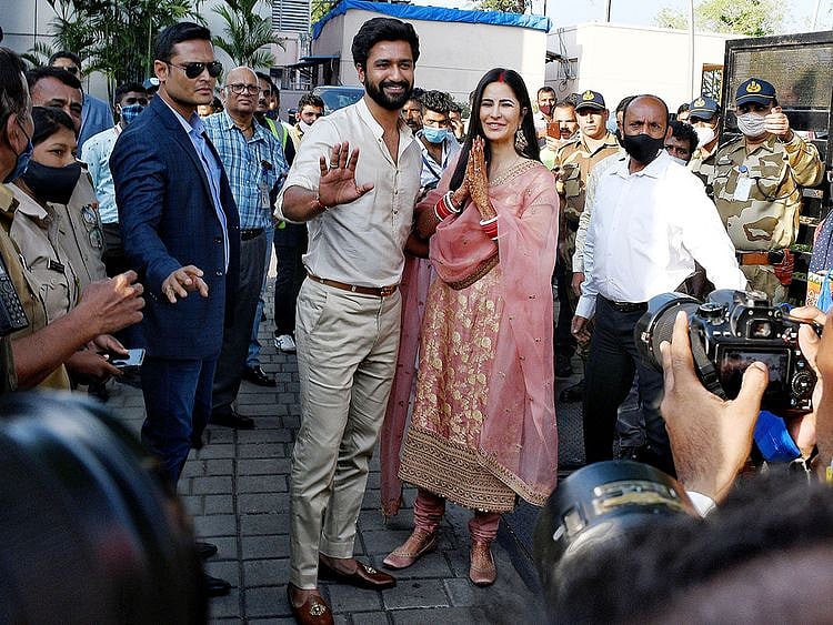  Bollywood actor Vicky Kausal with his wife and actress Katrina Kaif poses for the photo on their arrival to Mumbai, on Tuesday.