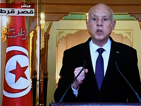 A television screen in Tunisia’s capital Tunis on December 13, 2021, displaying an announcement by Tunisian President Kais Saied, in which he said that the Tunisian parliament would remain suspended until elections set for December 2022, and that a referendum on constitutional reforms would be held in July of that year. 