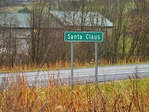 A road sign is seen at the town limits of Santa Claus, Indiana.