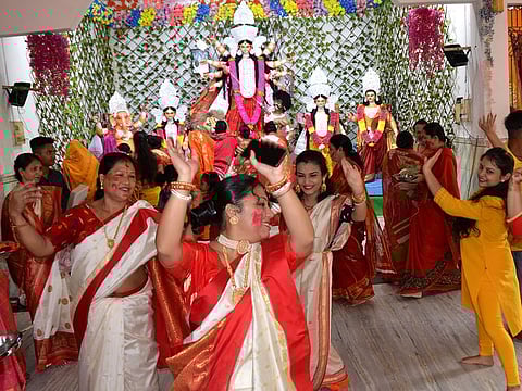 Devotees celebrate during performing rituals of 'Sindur Khela' on the last day of the Durga Puja festival, in Tezpur, in a file photo.. 