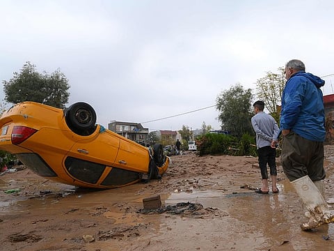 Residents inspect the damage in the area of Daratu, on the outskirts of Arbil, after flash floods caused by torrential rains. 