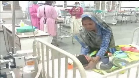 Divyanshi with her mother at a hospital after she was rescued from the borewell.