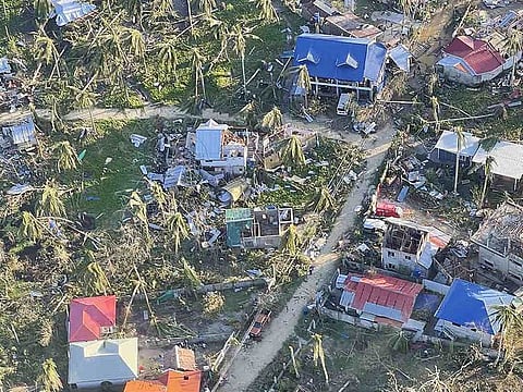 This aerial handout photo received from the Philippine Army on December 18 shows destroyed houses caused by Super Typhoon Rai after the storm crossed over General Luna, Siargao Island. 