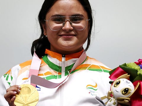 Shooter Avani Lekhara shows her gold medal after winning in women's R2-10M Air Rifle standing SH1 event in Tokyo Paralympics 2020.