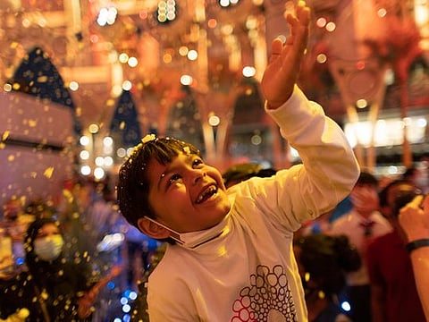 In photos: Children delight in snowfall at Expo 2020 Dubai's Christmas tree ceremony