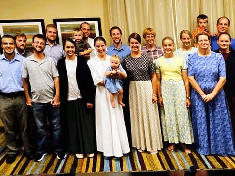 A photo of the 17 freed hostages taken in Florida is seen at the press conference at Christian Aid Ministries home office in Berlin, OH on December 20, 2021. 