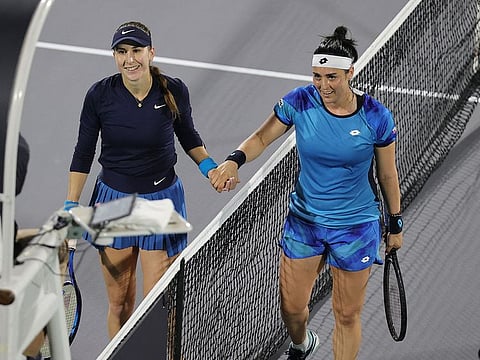 Tunisia's Ons Jabeur shakes hands with Switzerland's Belinda Bencic after their match in Abu Dhabi