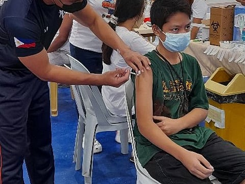 File photo shows a vaccination drive for 12- to 17-year olds in the Philippines on December 12