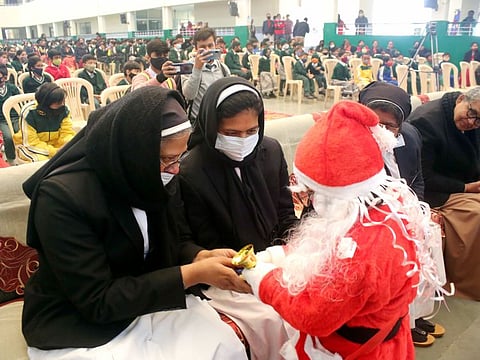 A Student dressed as Santa Claus greets sisters at a cultural programme during Christmas celebrations at St. Joseph Co-ed School, in Bhopal on Wednesday. In an announcement late Thursday evening, Madhya Pradesh Chief Minister Shivraj Singh Chouhan said: “We can impose curfew during night hours (between 11pm to 5am) If needed, some more measures will be implemented.”