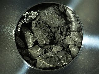 Japanese spacecraft's gifts: Asteroid chips like charcoal