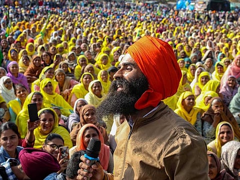Well-known Punjabi singer Kanwar Grewal performs to support farmers' ongoing agitation over new farm laws, at Tikri border in New Delhi, Monday, Dec. 28, 2020. 
